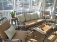 Lots of furniture in the sun-room enable many friends and family comfortable living space.